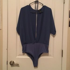 Here I have a sexy open blue bodysuit
